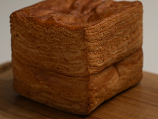 Tissue bread or layer toast on wooden cutting board