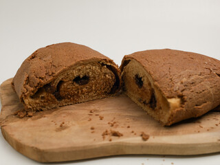 Loaf of bread on wooden cutting board