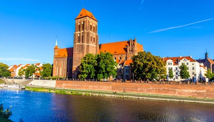 Obraz premium Medieval church by a river