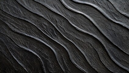 Black textured background with a wavy pattern, perfect for adding contrast and texture to your designs. The background has a grainy texture, with black colors, and is seamless.