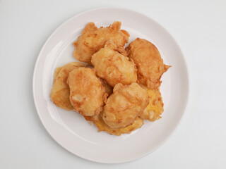 Fermented cassava fritter on white plate