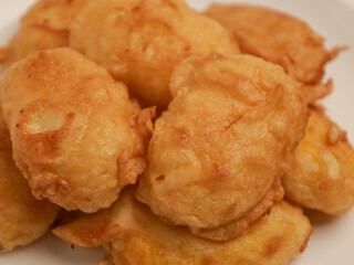 Fermented cassava fritter on white plate