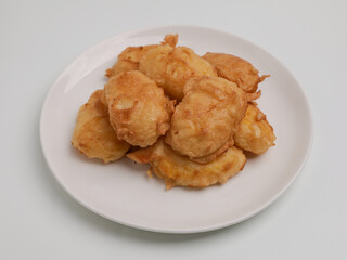 Fermented cassava fritter on white plate