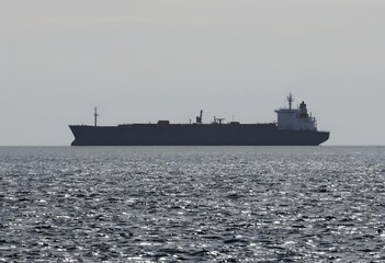 Silhouetted Oil Tanker on Calm Sea