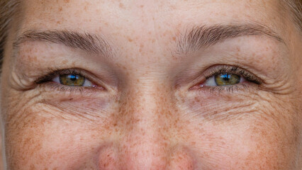 Close up of smiling female eyes looking at camera with wrinkles