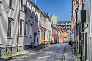 Quiet Street Lined With Colorful Historic Houses and Cobblestone Walkway,Trondheim, Norway
