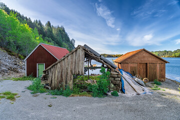 Rustic Coastal Sheds and Ruins Against a Scenic Seaside Background, Boemlo, Norway