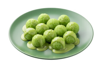 A plate of vibrant green rice balls, glistening with a creamy sauce, arranged attractively on a muted sage-green plate.
