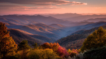 Aerial view of mountain range covered with trees during daytime with pink and orange sky view