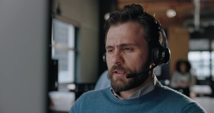 Computer, man and talking with headache in call center for difficult client, tech support and burnout. Coworking, tired agent and PC with migraine for customer service issue, brain fog or overwhelmed