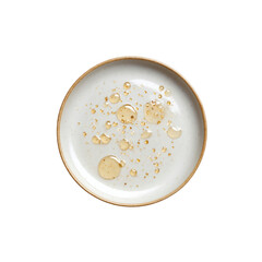 Overhead View of Honey or Oil Droplets on a Small Ceramic Plate