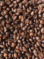 Close up top view of fresh roasted coffee beans background 