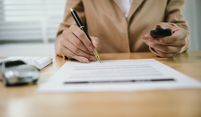 A client signs a contract with a salesman, receiving car keys, symbolizing finance, insurance, purchase, investment, security, ownership, and success.