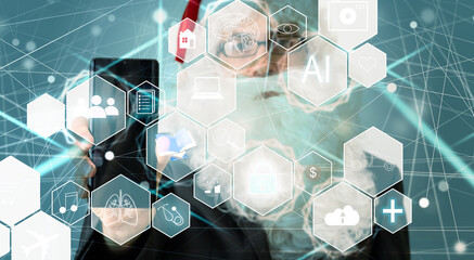 Manager Technical Industrial Engineer working and control robotics with monitoring system software and icon industry network connection on tablet. AI, Artificial Intelligence.