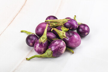 Small organic young purple round eggplant