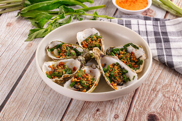 Gournet grilled oysters with onion and peanut