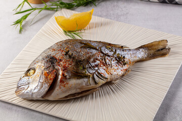 Baked dorada fish with spices