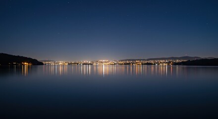 Fototapeta premium City lights reflected on still water at night (2)