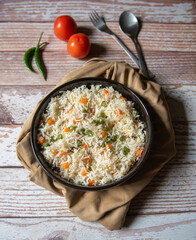 Vegetable pulao or basmati rice made with vegetables served in a bowl. Close up, selective focus.