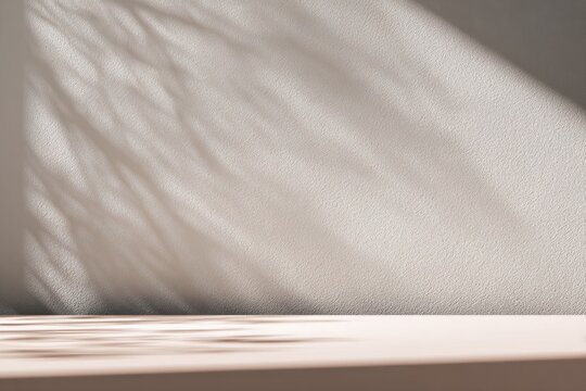 Abstract gray silhouette of tree branch. Beige light brown wall background. Transparent blur shade tropical leaves sunlight. Closeup of plant shadow motion. Natural light bokeh. Trend Overlay effect