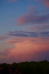 Clouds over the forest in summer