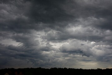 Clouds over the forest in summer