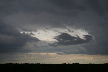 Clouds over the forest in summer
