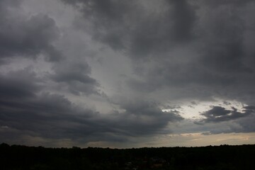 Clouds over the forest in summer