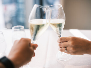 Romantic Celebration Toast with Champagne Glasses at Elegant Dinner