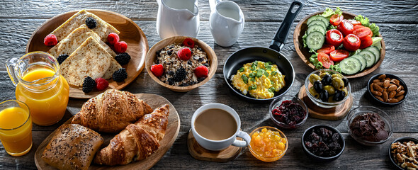 Breakfast served with coffee, eggs, cereals nd croissants