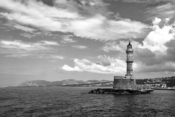 stone, historic lighthouse in the harbor of Chania on the island of Crete