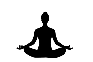 Serene silhouette of a person meditating in lotus pose, finding inner peace and balance with mindful breathing for wellness and calm.