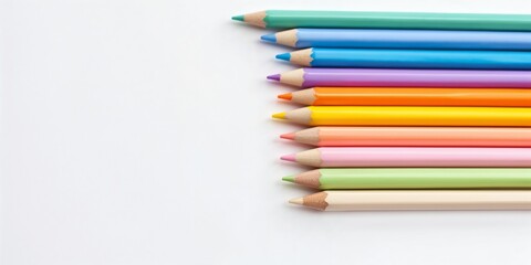 Pastel colored pencils neatly arranged on white background, perfect for stationery and education content