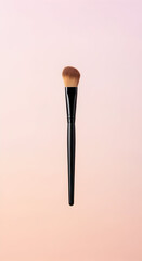 Makeup Brush on Soft Pink Background Beauty Tool