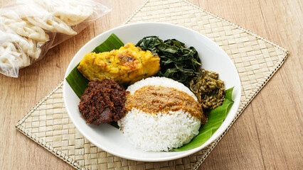 Nasi Padang or Nasi Kapau, rice with various side dishes rendang, egg, and sambal. Indonesian Food