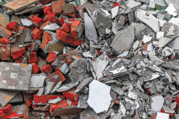 Pile of construction debris with bricks and concrete rubble
