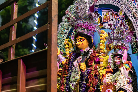 Durga Puja with idol of goddess Durga being transported for festival during vijaya dashami for visarjan or immersion.
