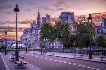 Calm sunrise illuminates empty streets near City Hall in Paris, France