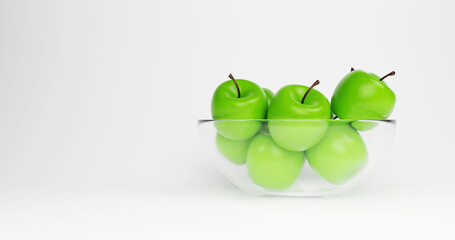 Glass Bowl Filled With Green Apples On White background