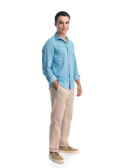 Fototapeta premium handsome young guy in blue jeans shirt standing and smiling