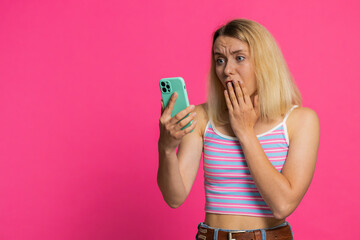Upset sad Caucasian woman use smartphone typing browsing, play game, loses, surprised by sudden...