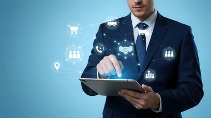 Businessman interacting with digital icons on a tablet, symbolizing various business and technology functions.