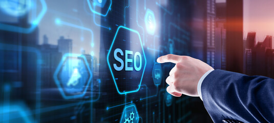 Businessman's fingers pressing a button SEO. Search engine optimization