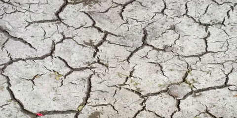 Printplastic polluted cracked earth background. Global warming, climate change and global warming concept. Environmental pollution