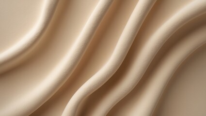 Obraz premium Close-up of beige-colored fabric with smooth, flowing folds and curves.