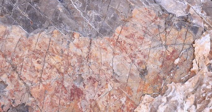 Push in closeup on multi color rock surface looking like abstract painting with crack pattern and gray outside 4k