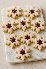Traditional striped candy cane cookies arranged in rows on baking surface