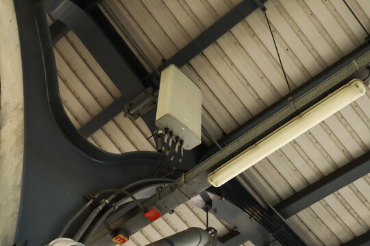 indoor-mounted telecommunications antenna or cell site attached to the ceiling of a building.