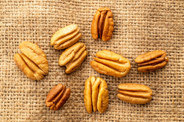 Shelled pecan nuts, top view, macro.