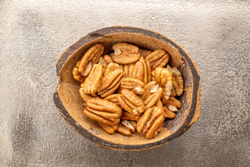 Shelled pecan nuts, top view, macro.